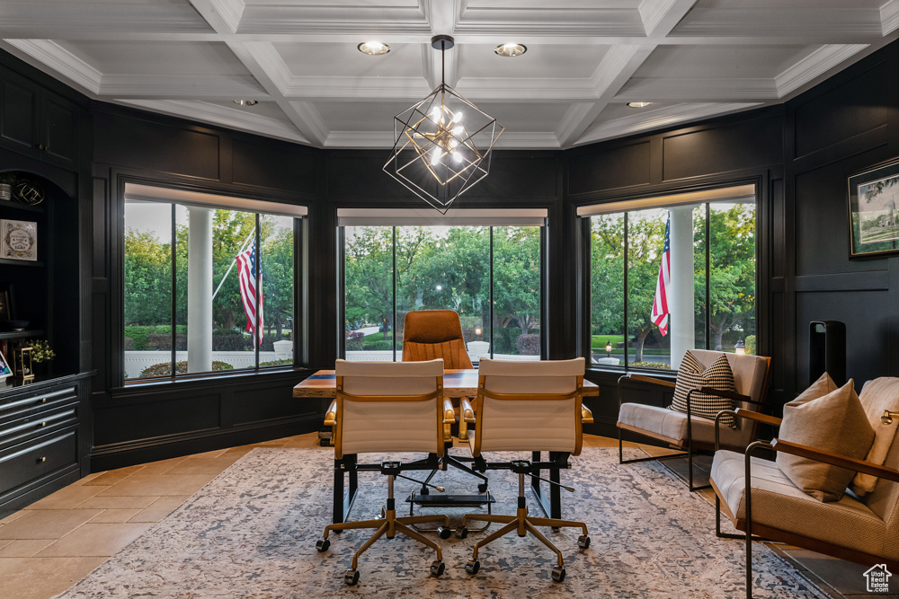 Tiled home office with an inviting chandelier, beamed ceiling, and coffered ceiling