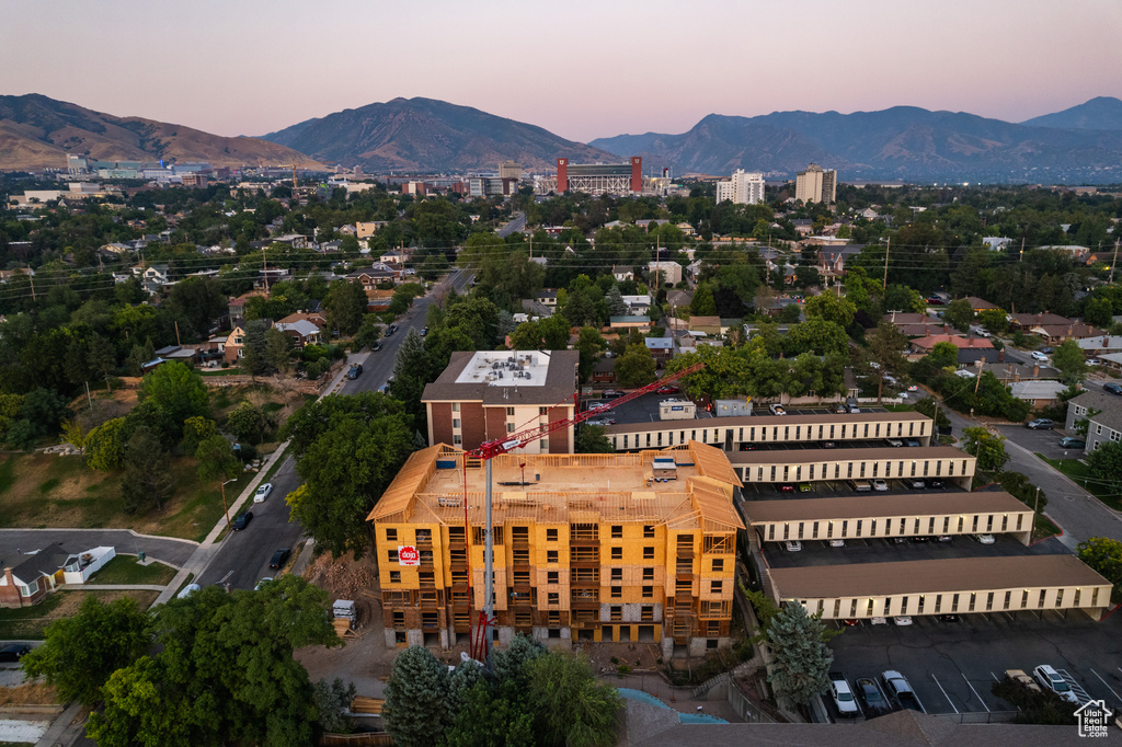 Aerial view at dusk featuring a mountain view