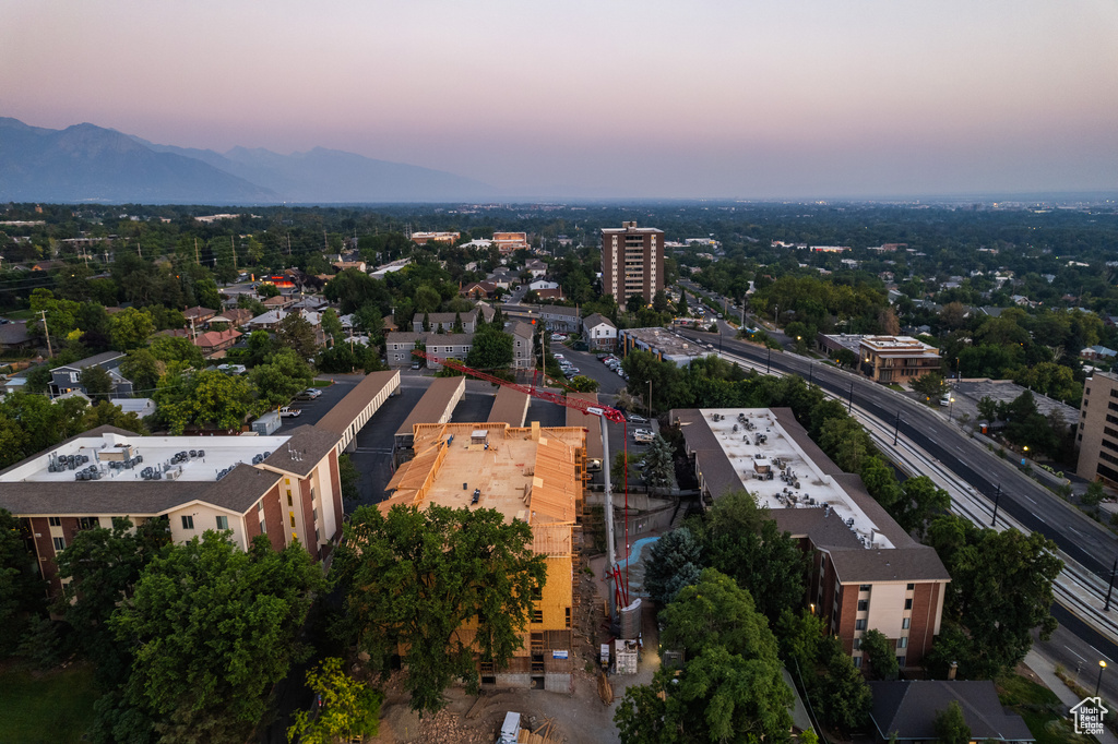 Aerial view at dusk featuring a mountain view