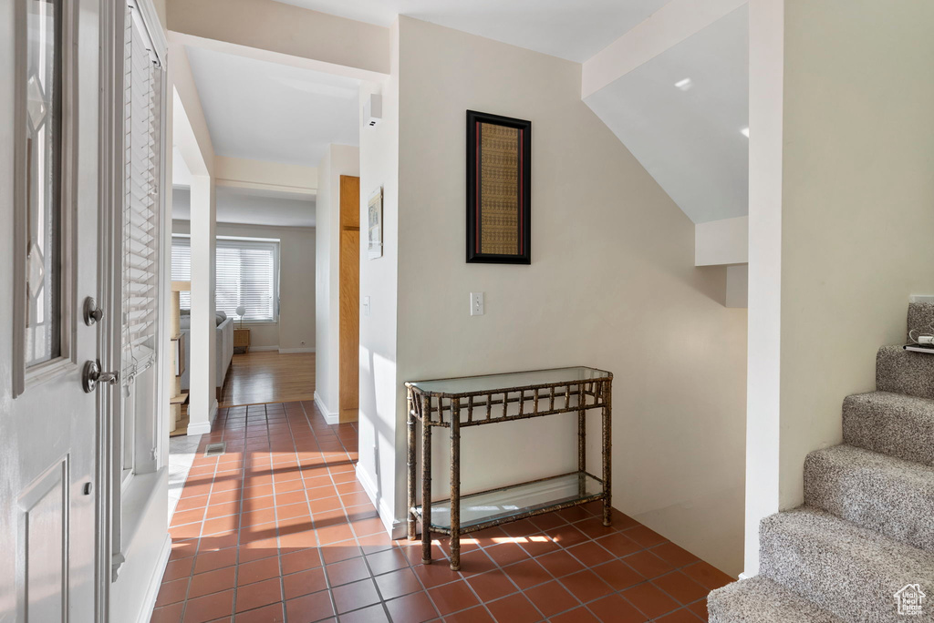 Interior space with dark tile patterned flooring