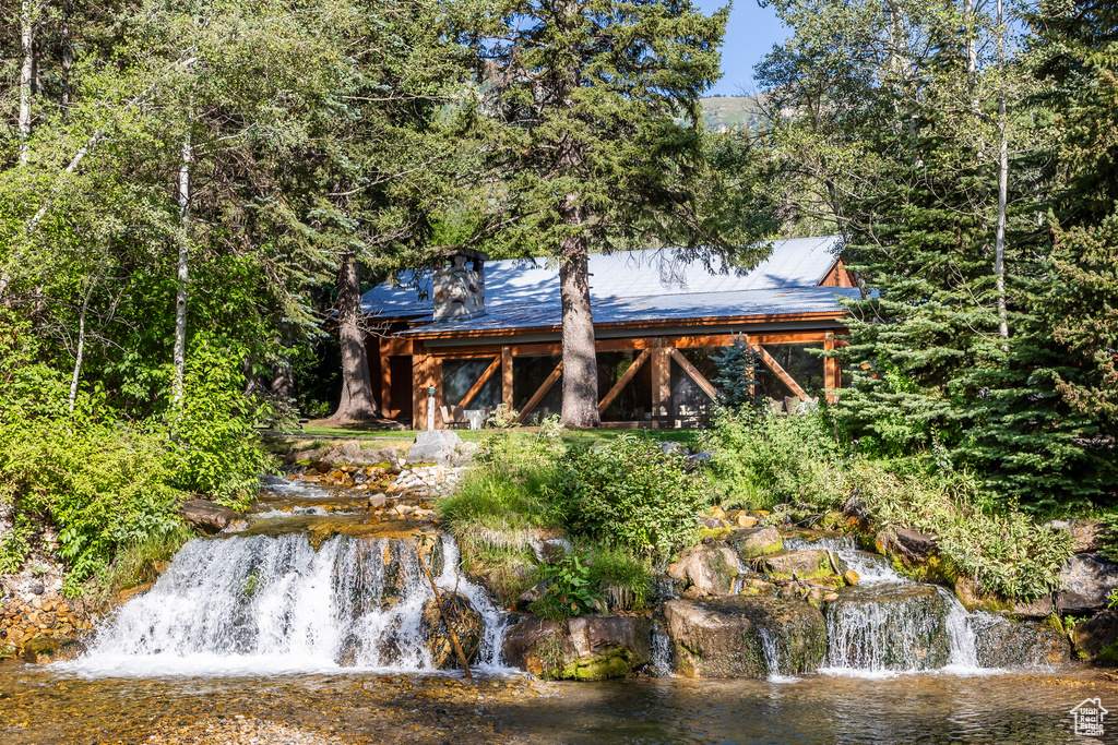 Rear view of property with a water view