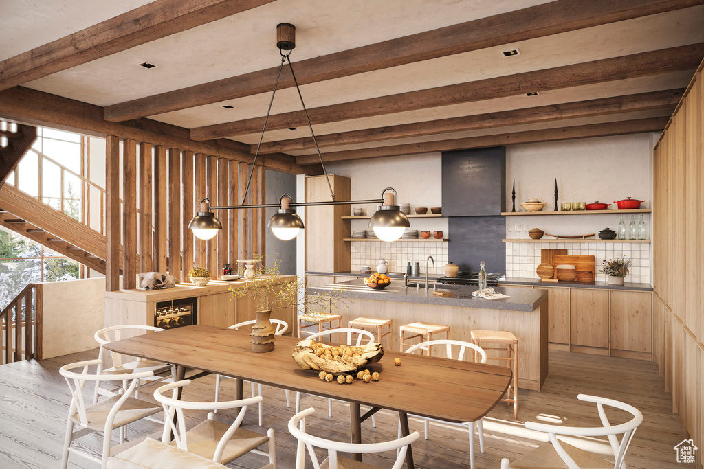 Interior space featuring beam ceiling and light wood-type flooring