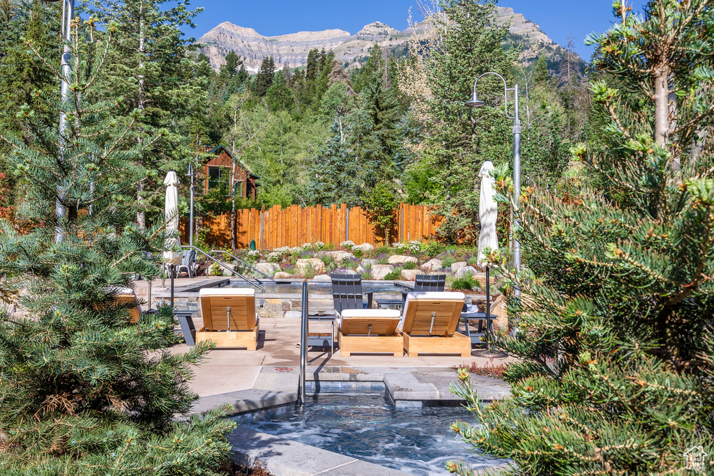 View of patio / terrace featuring a mountain view and an outdoor hangout area