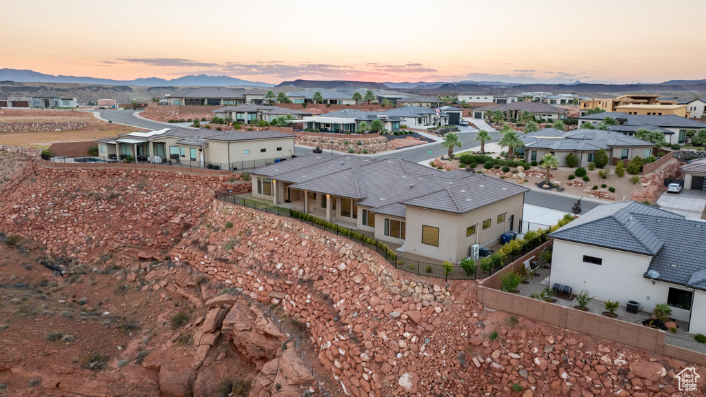 Aerial view at dusk featuring a mountain view