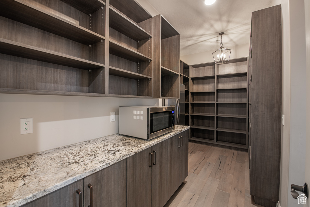 Interior space featuring light hardwood / wood-style flooring and a chandelier