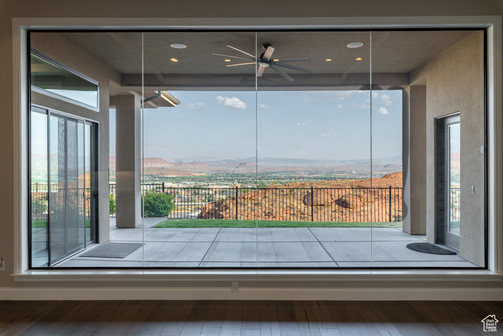 Interior space with hardwood / wood-style flooring and ceiling fan