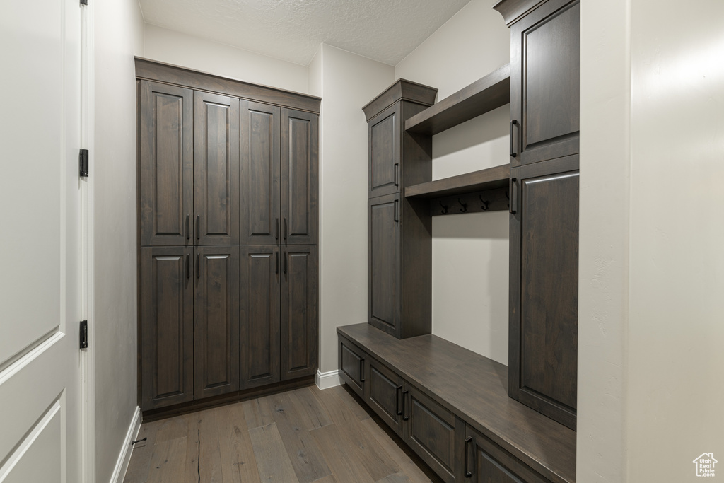 Mudroom with wood-type flooring