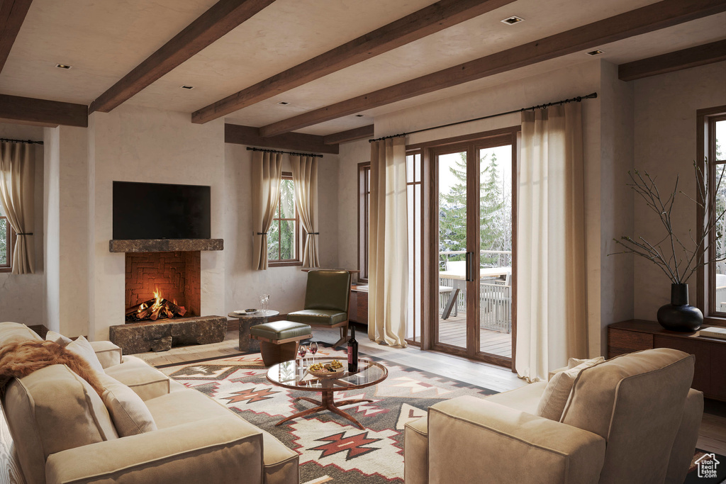 Living room with a premium fireplace, beamed ceiling, light hardwood / wood-style flooring, and a wealth of natural light