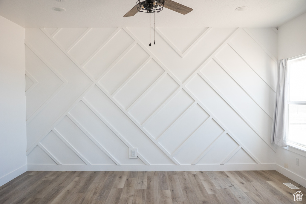 Detailed view of ceiling fan and wood finished floors
