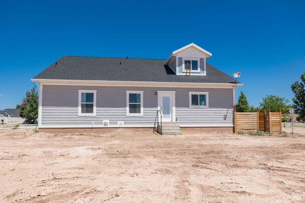 View of front of property featuring roof with shingles
