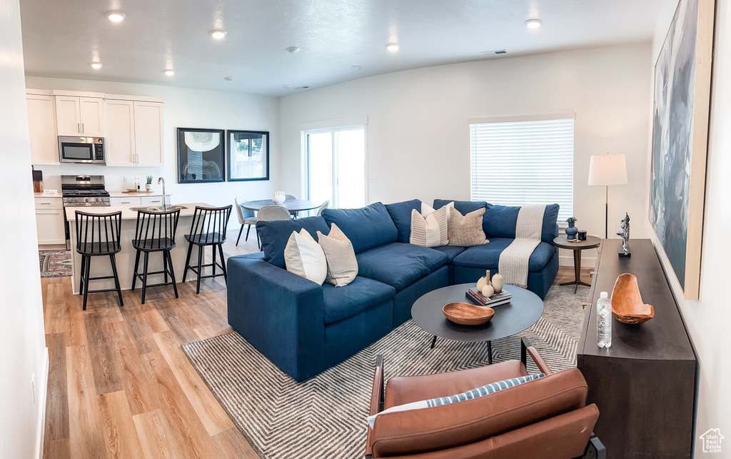 Living room with light wood-type flooring