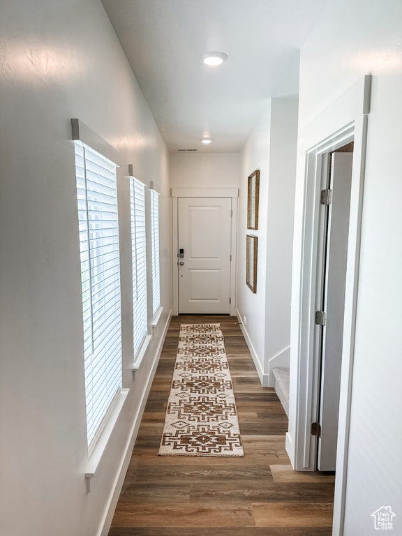 Corridor featuring dark hardwood / wood-style floors
