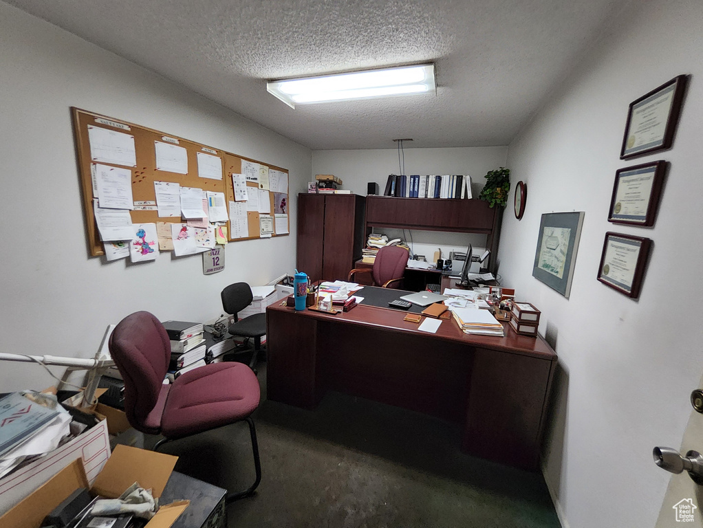 Office area with a textured ceiling