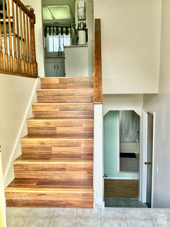 Staircase with tile patterned flooring