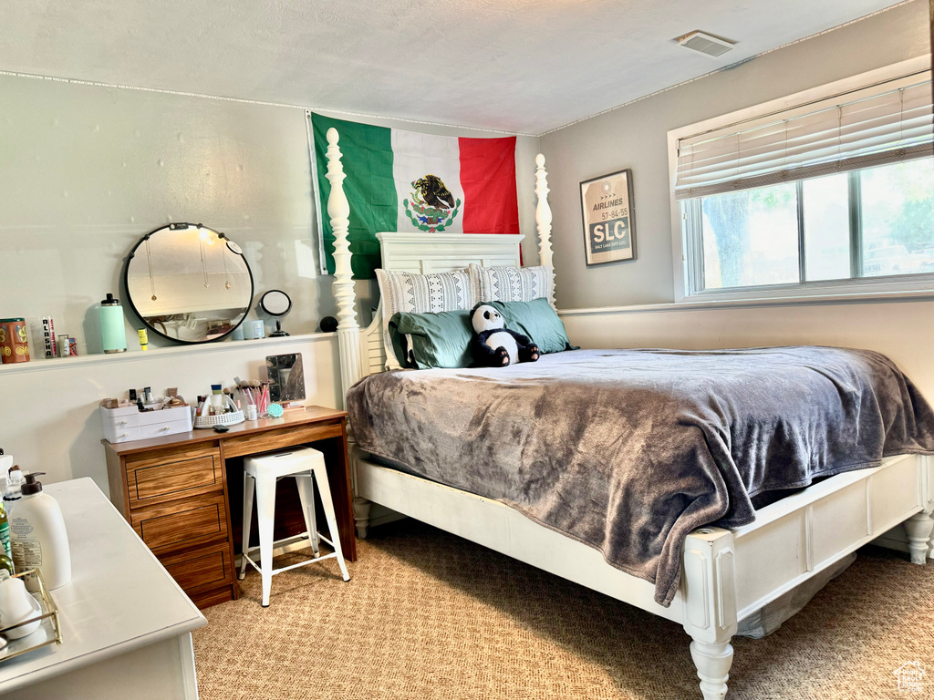 Bedroom with light carpet