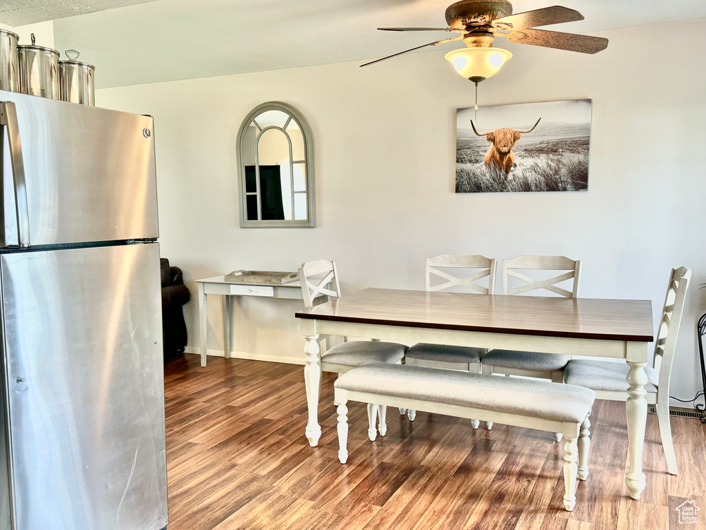 Dining space featuring hardwood / wood-style floors and ceiling fan