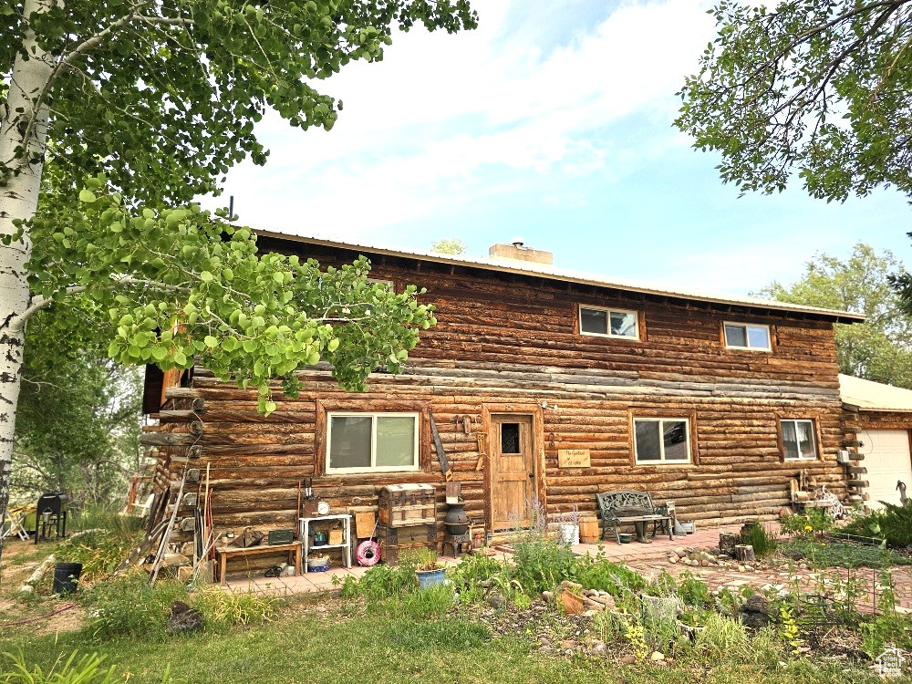 Rear view of property featuring a patio