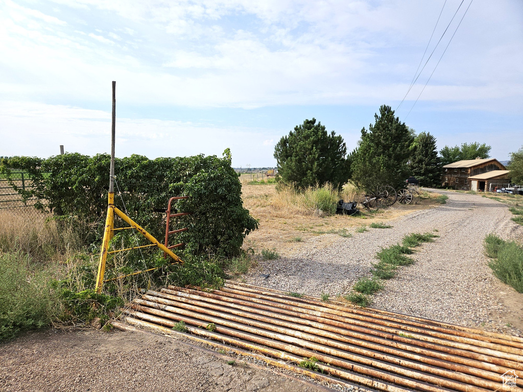 View of yard with a rural view