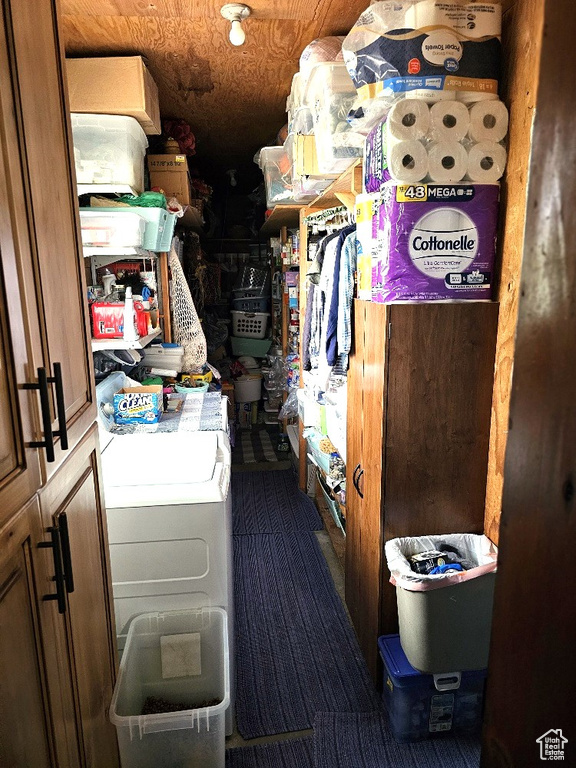 Storage room featuring washer / dryer