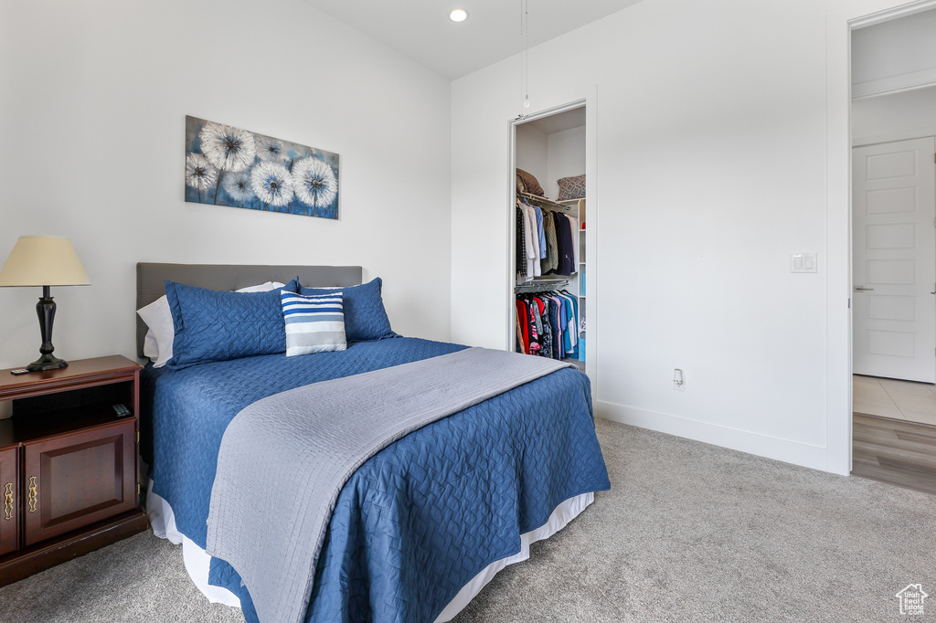 Bedroom featuring light hardwood / wood-style flooring and a closet