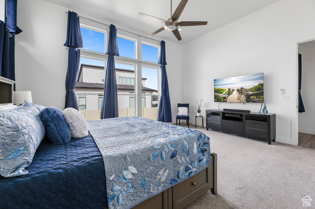 Carpeted bedroom with ceiling fan