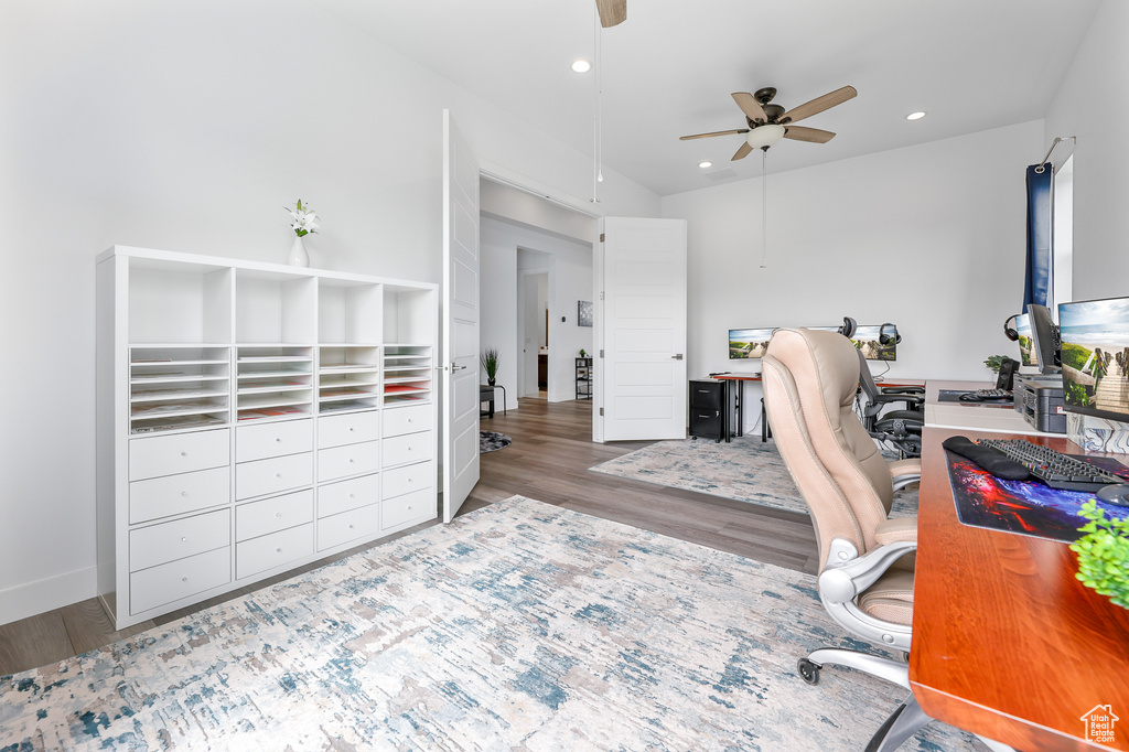 Home office featuring light hardwood / wood-style flooring and ceiling fan