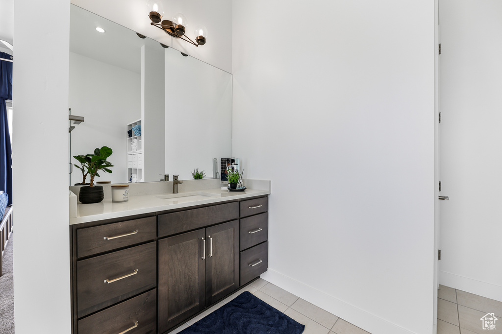 Bathroom with vanity and tile patterned flooring