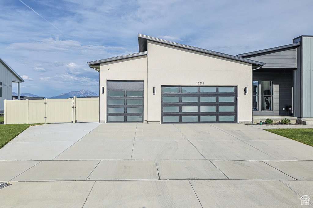 Exterior space with a mountain view and a garage