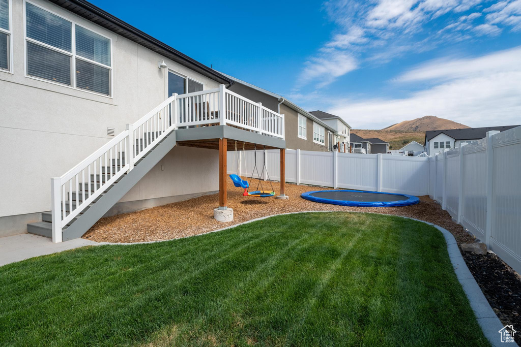 View of yard featuring a wooden deck