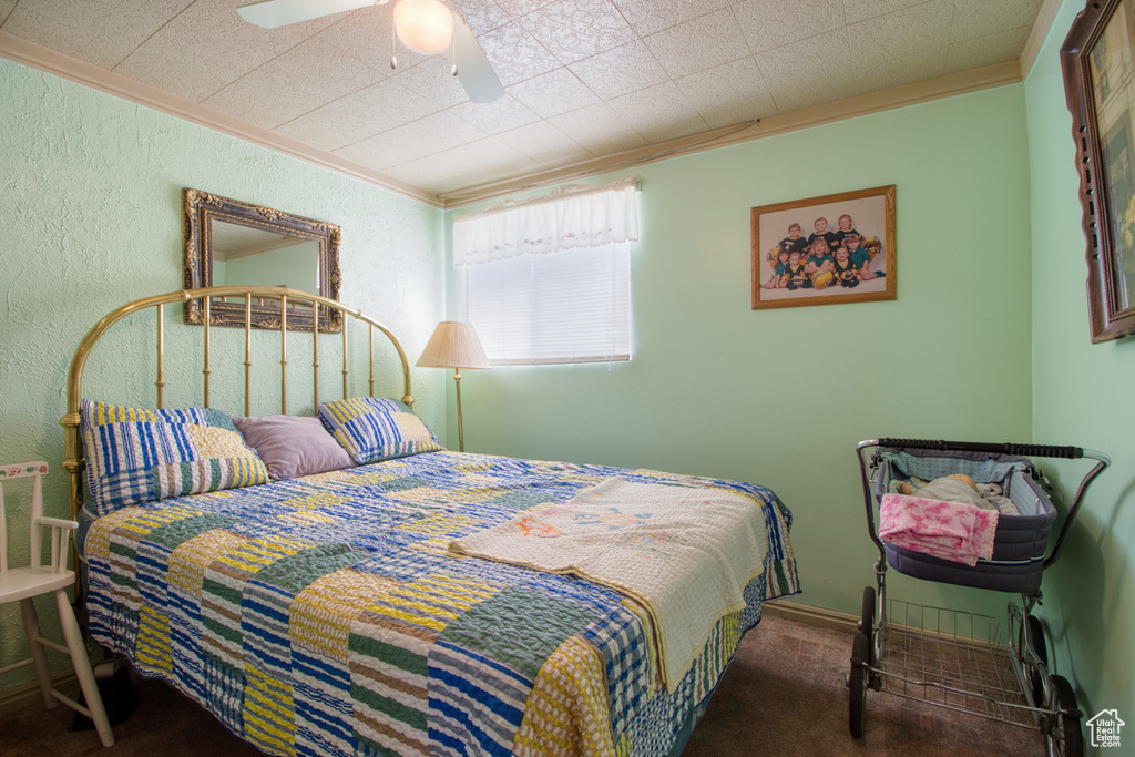 Bedroom featuring crown molding and ceiling fan