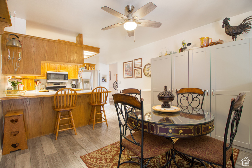 Dining space featuring light hardwood / wood-style floors and ceiling fan