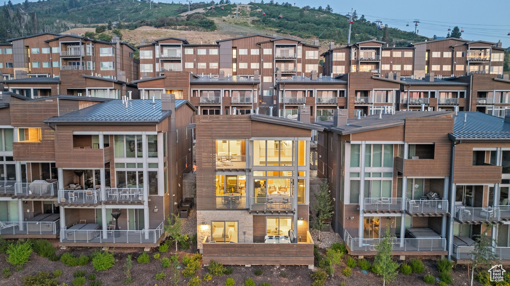 Rear view of property with a balcony