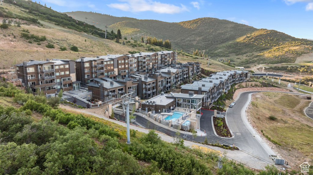 Birds eye view of property with a mountain view