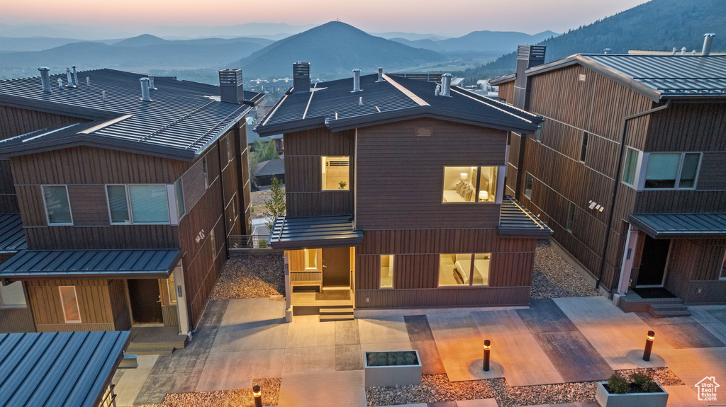 Contemporary house with a patio and a mountain view