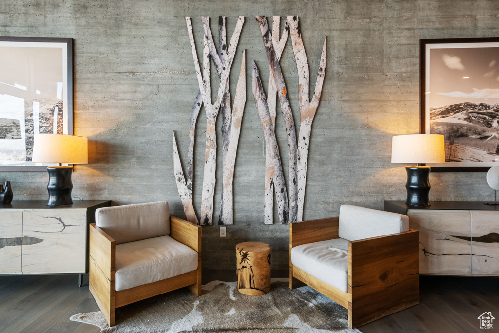 Sitting room with wood-type flooring