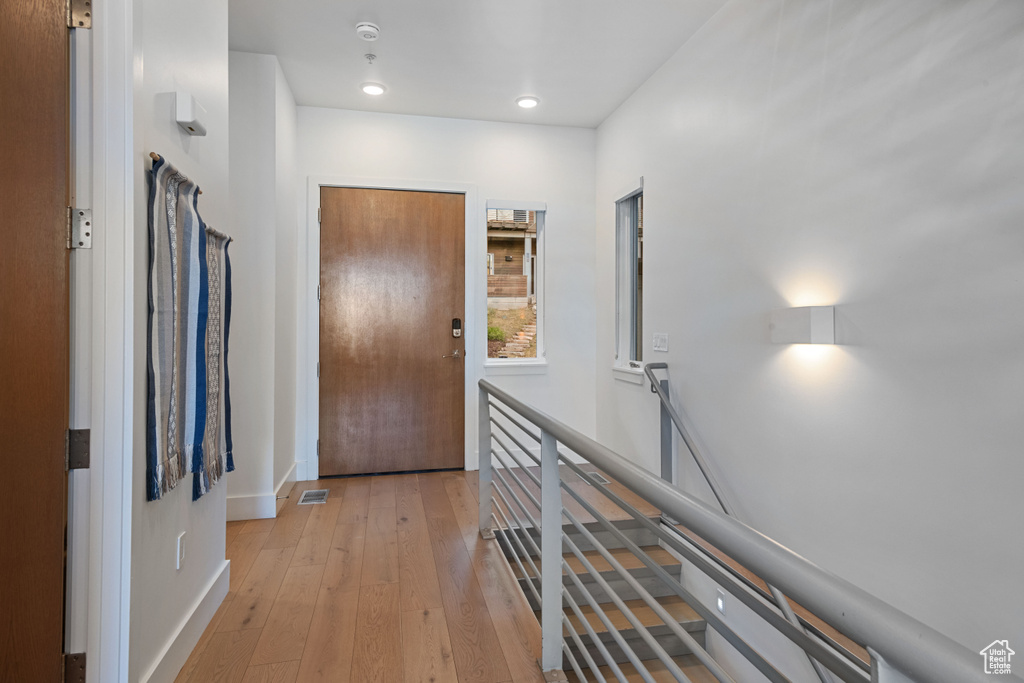 Corridor with light wood-type flooring