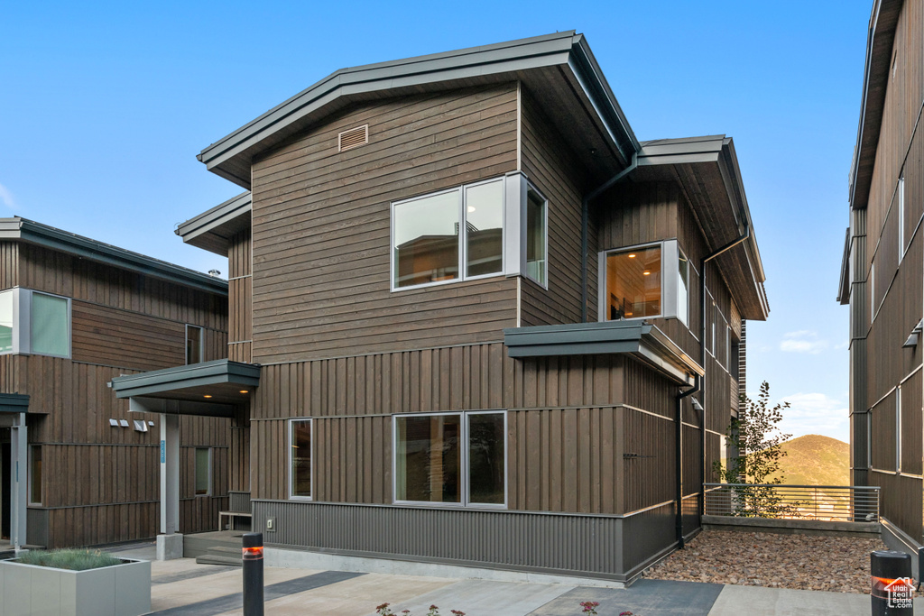 Rear view of house featuring a patio