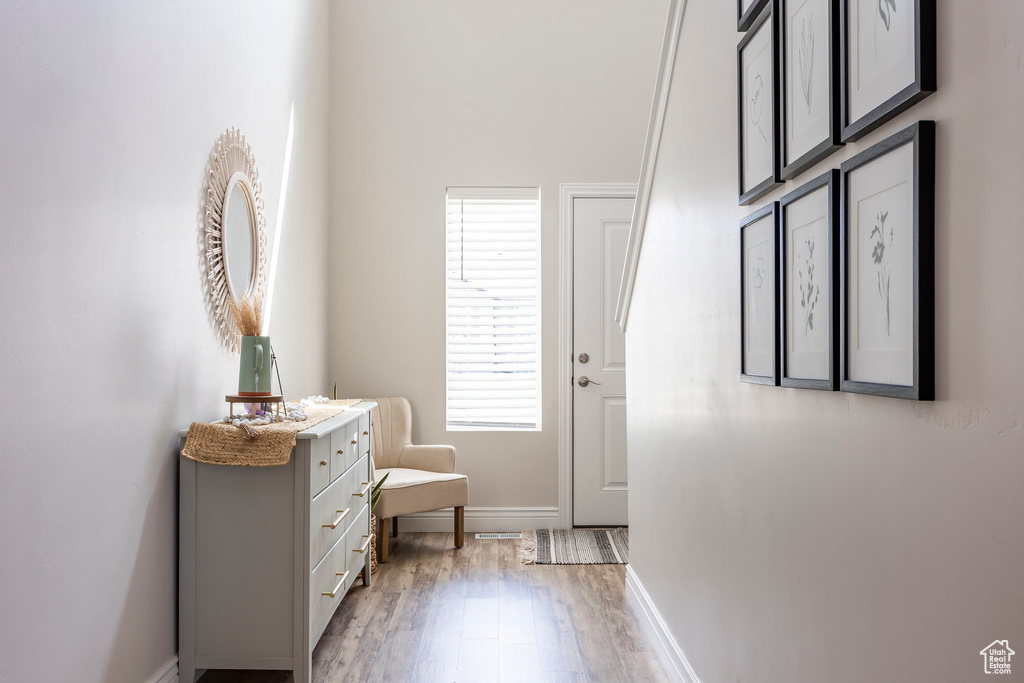 Interior space with vanity and hardwood / wood-style floors