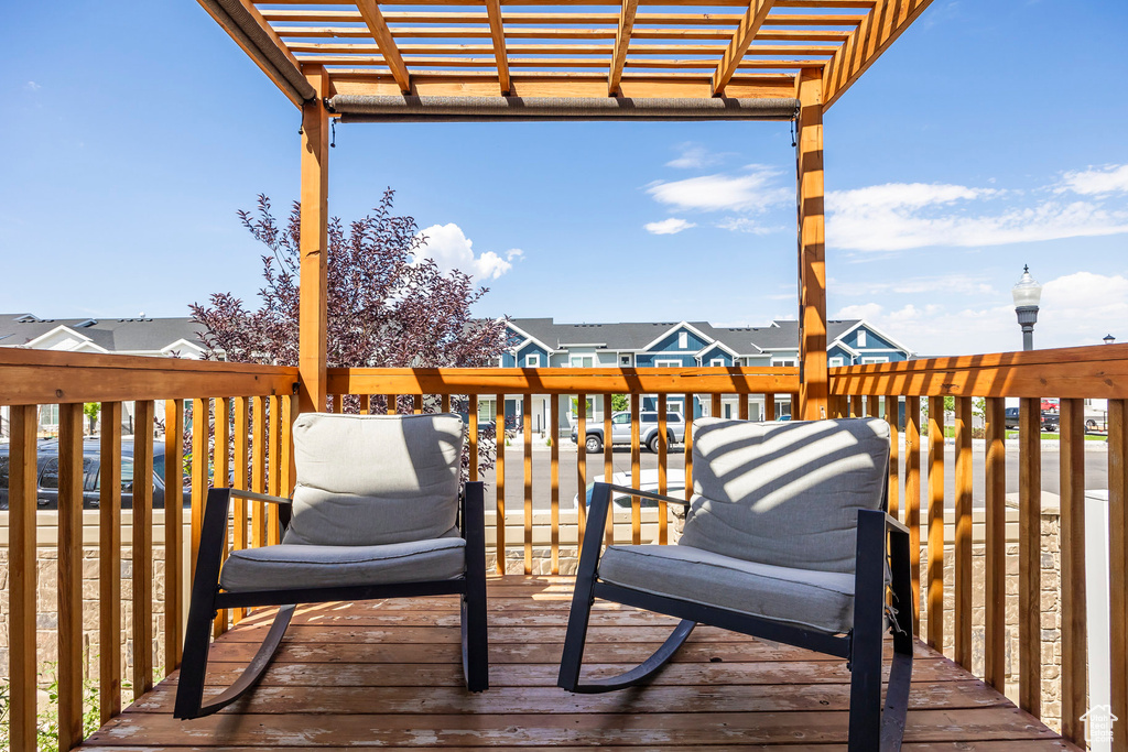 Deck featuring a pergola