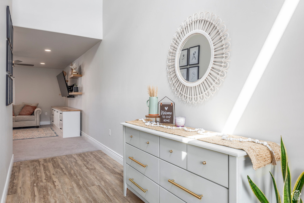 Interior space with ceiling fan and hardwood / wood-style floors