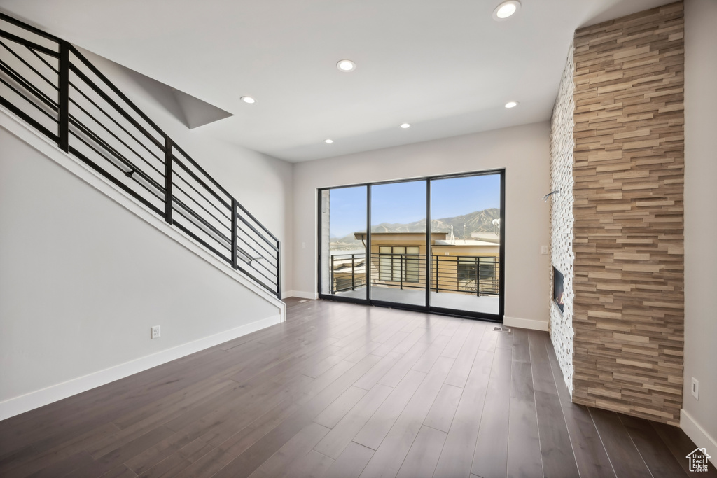 Unfurnished living room with hardwood / wood-style floors