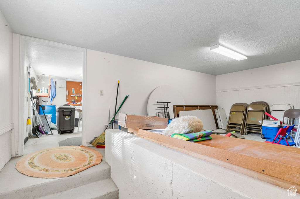 Miscellaneous room featuring a textured ceiling