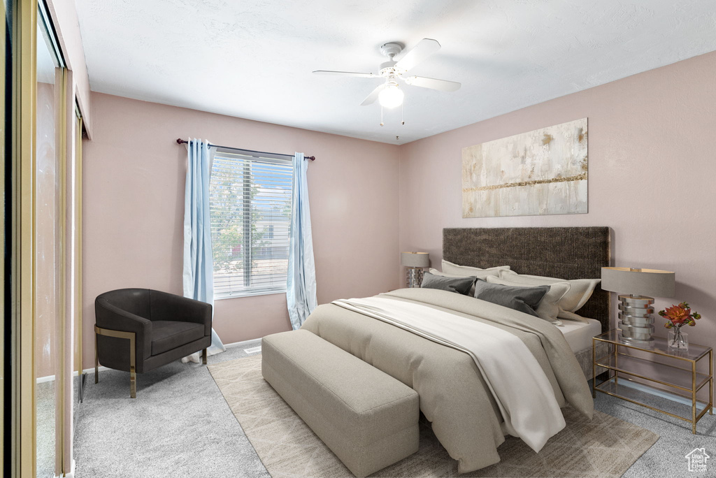 Bedroom with light carpet and ceiling fan