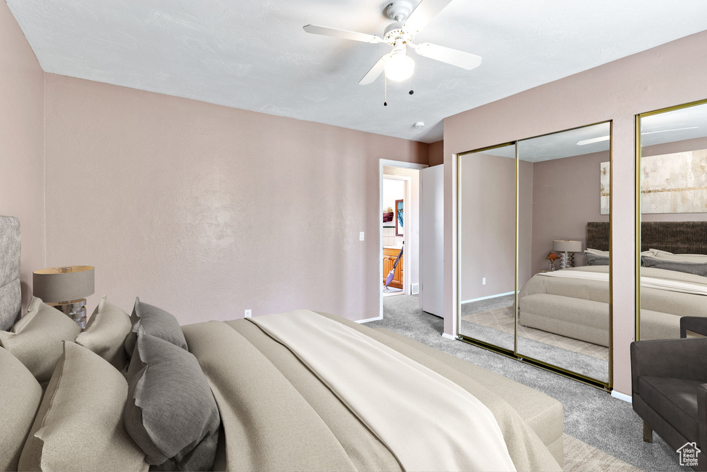 Bedroom featuring carpet and ceiling fan