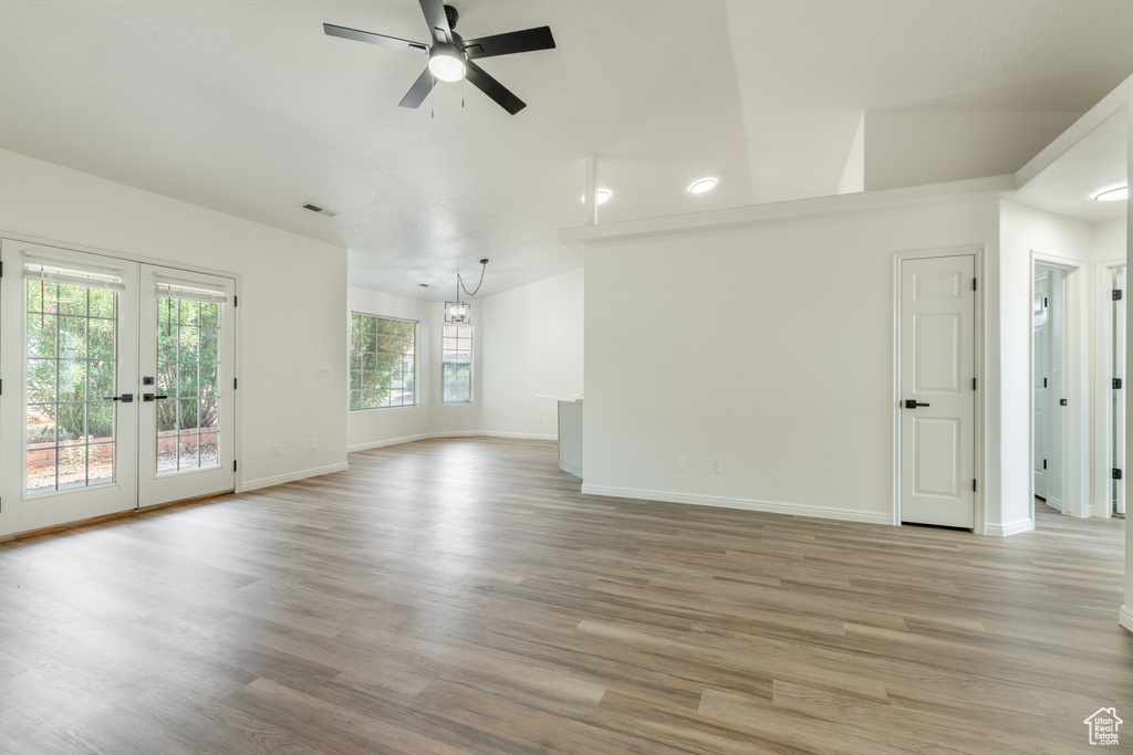 Interior space featuring wood-type flooring, ceiling fan, and french doors