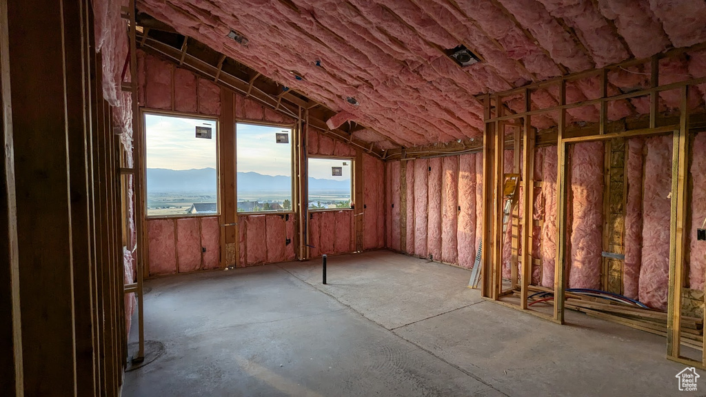 Miscellaneous room with a mountain view and lofted ceiling