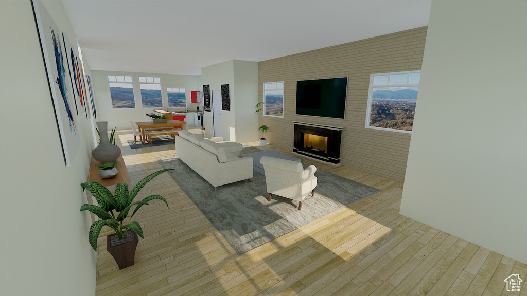 Living room featuring light hardwood / wood-style flooring and a healthy amount of sunlight