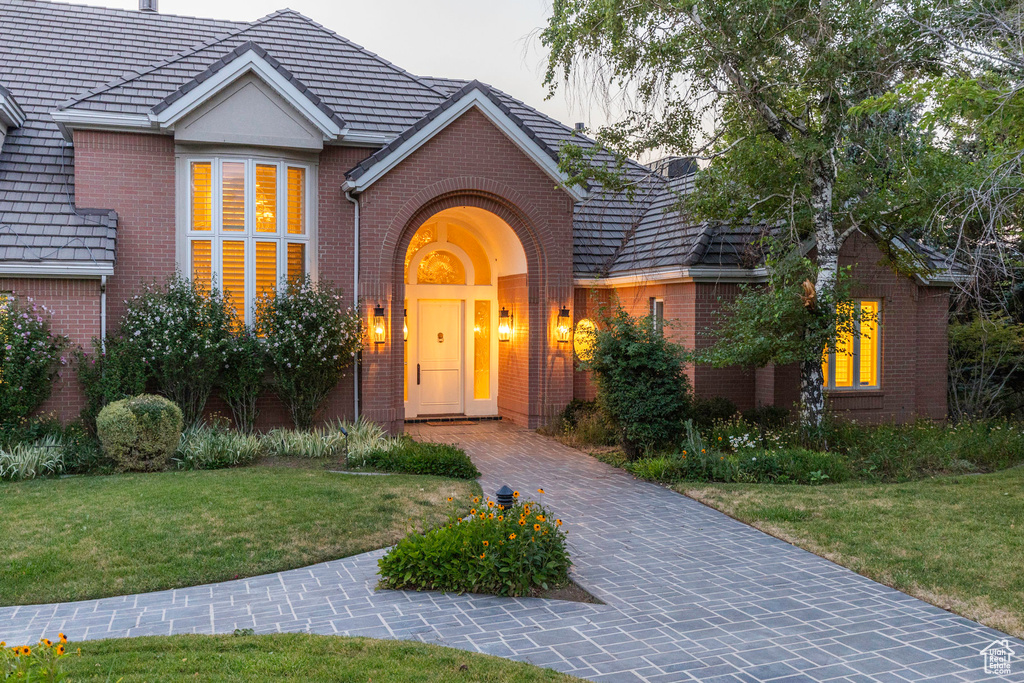 Tudor home featuring a front lawn