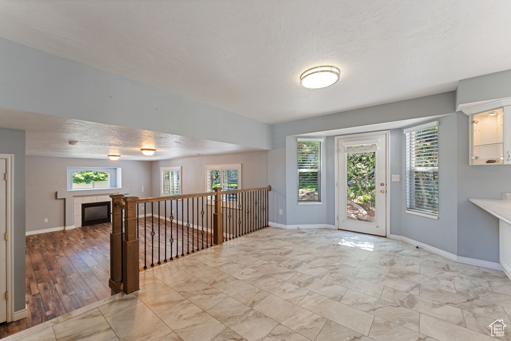 Foyer with light wood-type flooring and plenty of natural light