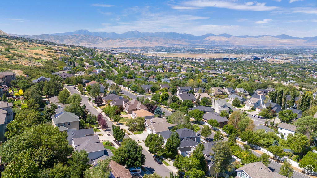 Birds eye view of property with a mountain view